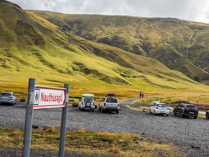 Signpost at parking lot of gorge Nauthusagil, hiking path, Katla Geopark, Iceland