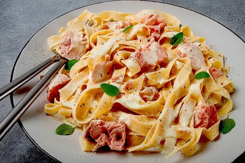 Tagliatelle pasta, in cream sauce with salmon, homemade, no people