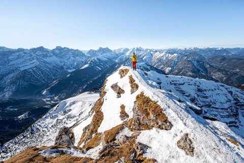 Ski tourers at the summit of Schafreuter, view of snowy mountain panorama, Sonnenstern, Karwendel,