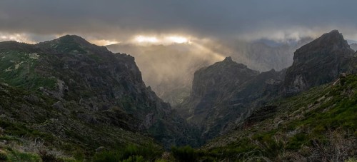 Sunset at Pico do Arieiro, sun shining through clouds, sunbeam, hiking trail PR1, Madeira, Portugal