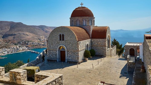 Agiou Sarvas monastery, Agion Pandon church, stone church with dome on a hill overlooking sea and