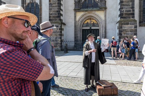 City tour with Philipp Melanchthon in historical costume in the old town, here in front of the