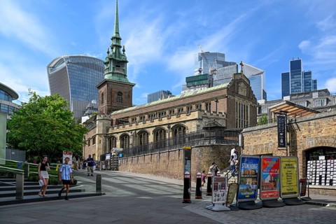 All Hallows-by-the-Tower church in front of the skyscrapers of the Broadgate district, banking