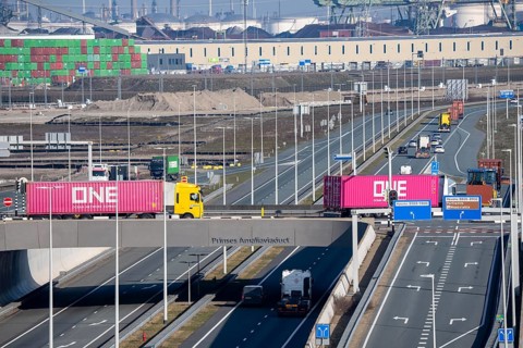 Container trucks on Maasvlakte 2, deep sea port, bring containers to and from container terminals