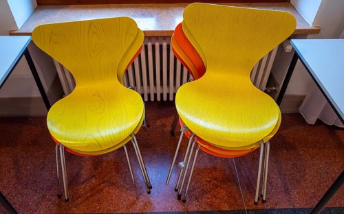 Colourful wooden chairs in the sixties style in a room in the Museum of Communication on Leipziger