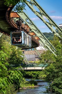 The Wuppertal suspension railway runs above along the Wupper River, between the central railway