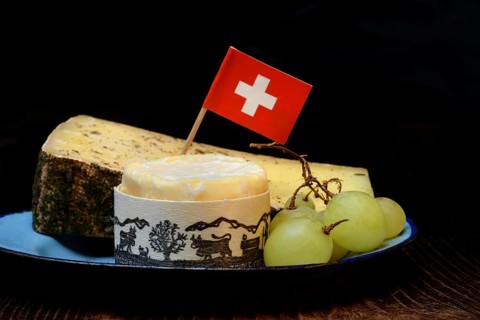 Plate of Swiss cheese, Gstaad mountain cheese with herbs and cream cheese 'Fette Berta',
