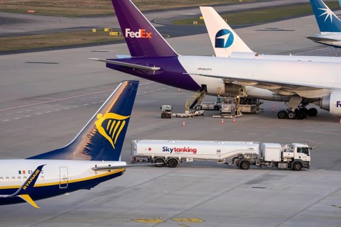 Ryanair Boeing 737 is ready for takeoff, tanker for air fuel, kerosene, tank truck from Skytanking