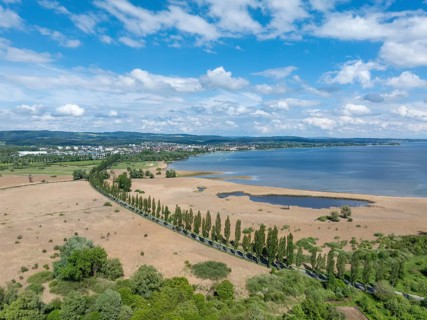 Aerial view of Mooser Damm with state road L192 which crosses Radolfzeller Aachried on the shore