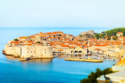 Panoramic view of Dubrovnik Old Town in Croatia with medieval stone walls, fortress, harbour and
