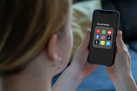 Symbolic image of social media use by young people, children, young woman, girl, 14 years old,