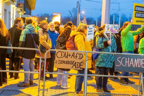 Protests against the CDU leader's approach to tightening up migration policy took place across