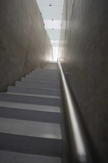 Looking up in a minimalistic concrete staircase with light accents, Kunsthaus Bregenz, Vorarlberg,