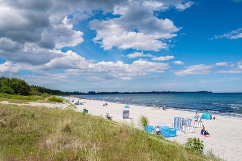 Sunny beach day with people in beach chairs, blue sky and clouds, Juliusruh, Breege, Rügen, Germany
