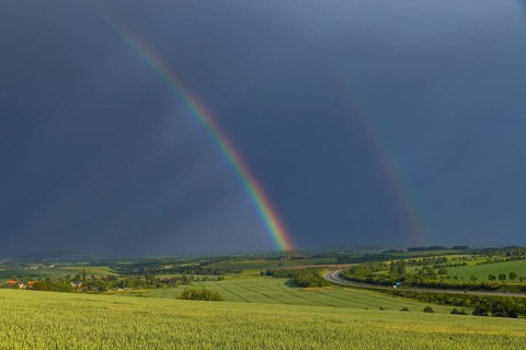 Thunderstorm cell with rainbow over fields near Krebs in the Osterzgebirge, Krebs, Saxony, Germany