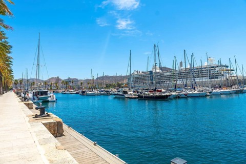 Cartagena port in murcia, spain, featuring numerous sailboats and a large cruise ship docked in the