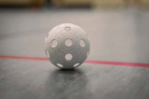 Floorball on the floor of a sports hall, focus on texture, foolball, Calw, Germany