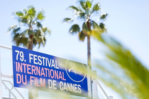 Sign for the 79th Festival International Du Film De Cannes in front of palm trees during the 79th