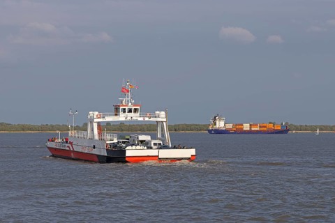 FRS Elbe ferry on the way to Glückstadt, container ship Nata A. Monrovia near Glückstadt,