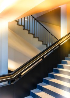 Carefully restored stairwell of the West Head Tower with newly developed steel staircase, which was