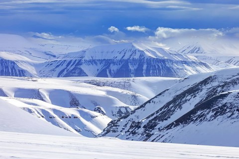 Snow covered mountains in Arctic landscape at Mohnbukta, bay at the western shore of Storfjorden in