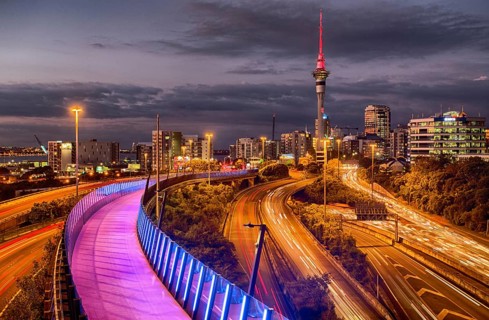 View towards the motorway and light path with sky tower in Auckland, New Zealand
