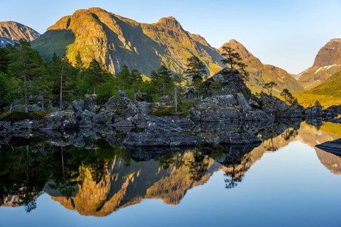 Picturesque mountain landscape with Innerdalstårnet peak in Innerdalen high valley, mountain peaks