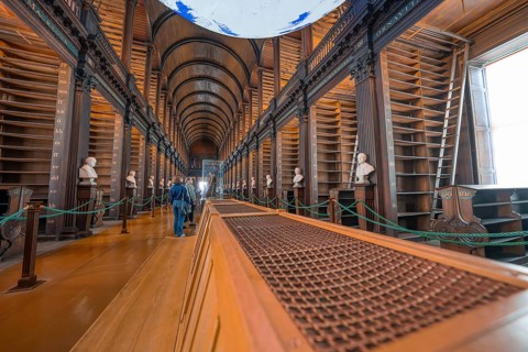 Wide library with vaulted ceiling and empty bookshelves, detailed view, Trinity Collage, Dublin,