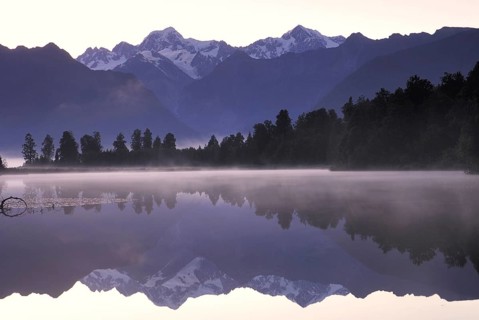 Mt Tasman and Mt Cook (Aoraki), Mount Cook National Park, are reflected in Lake Matheson, Westland