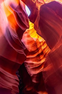 Antelope canyon displaying vibrant flowing sandstone walls sculpted by wind and water erosion, with
