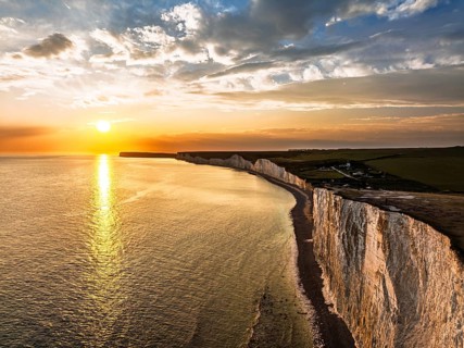 Sunset over Seven Sisters Cliffs from a drone, English Channel, East Sussex, South-east England