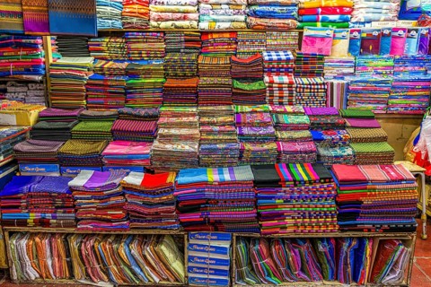 Colourful cloths lined up in a fabric shop, Kad Luang Warorod Market, Chiang Mai Thailand
