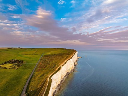 Sunset over Beachy Head Lighthouse from a drone, Beachy Head Cliffs, English Channel, East Sussex,