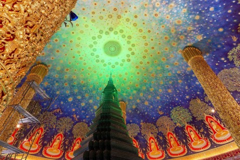 In the emerald green silence of Wat Paknam Phasi Charoen, the glass chedi rises like a glowing