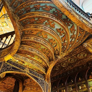 Livraria Lello, interior view of the Lello bookstore with rich decorations of the curved wooden