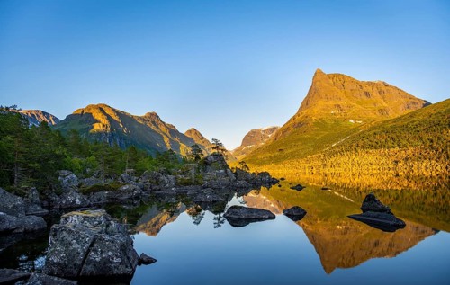 Picturesque mountain landscape with Innerdalstårnet peak in Innerdalen high valley, mountain peaks