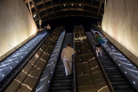 Washington, DC - Passengers ride escalators in and out of the Eastern Market station on the