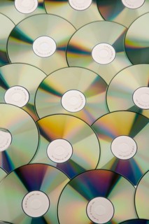 A table full of CD-ROM and DVD, pirated copy, studio recording, Austria