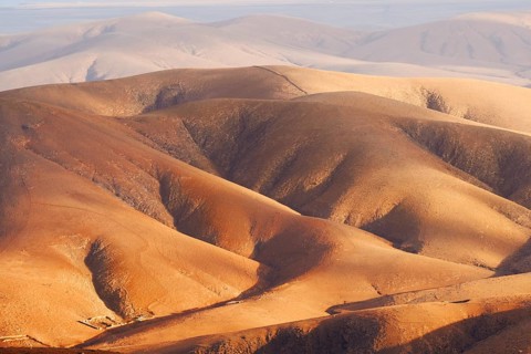 View of the barren and eroded landscape from the Mirador Morro Velosa viewpoint, Fuerteventura,