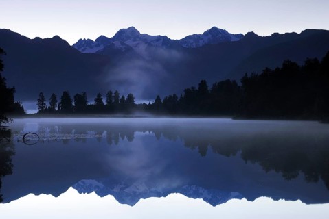Mt Tasman and Mt Cook (Aoraki), Mount Cook National Park, are reflected in Lake Matheson, Westland