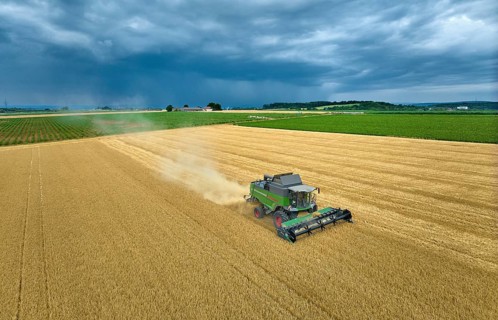 Combine harvester harvesting wheat on a field in the vertile and fruitful of Langes Feld north of