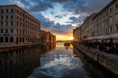 Grand Canal with restaurants, reflection in the canal, sunlight, evening light at sunset, dramatic