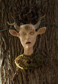 Sculpture by artist Andreas Pfenninger on a tree, Munich, Bavaria, Germany