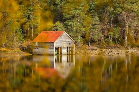 Boathouse on the shores of a lake in Scotland, Aviemore, Scotland, Great Britain