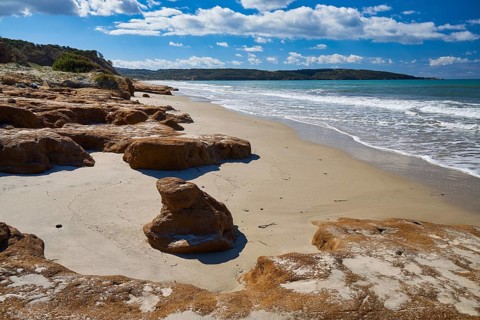 Vulcanic Beach, a peaceful stretch of beach with rocks and gentle waves, Kos, Dodecanese, Greek