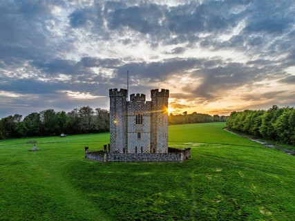 Sunset over Hiorne's Tower from a drone, Arundel, West Sussex, England, United Kingdom
