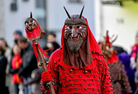 Member of a fools' guild in traditional Haes, fools' clothes, during the carnival procession in