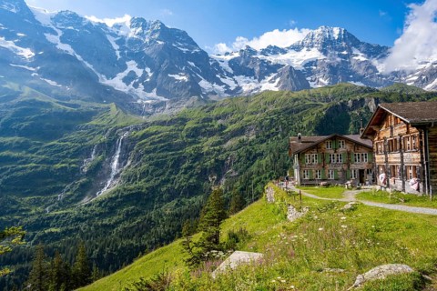 Picturesque mountain landscape with Berghotel Obersteinberg, Schmadribachfall waterfall and