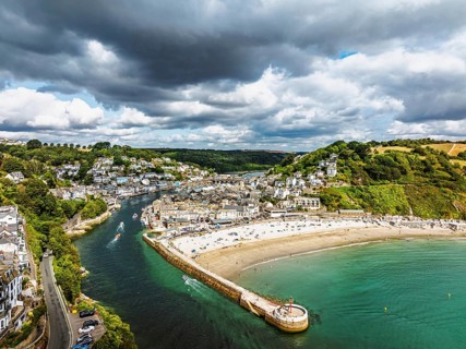 Beach and Cliffs over Looe Bay from a drone, Looe, River Looe, Cornwall, England, United Kingdom