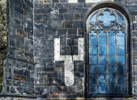Sundial and church window of the Grote Kerk, originally Middle Ages, fundamentally changed in the